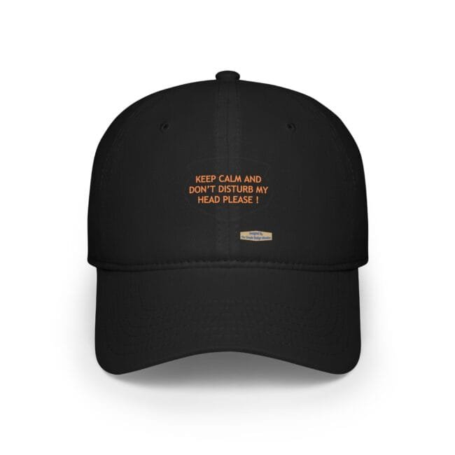Black baseball cap featuring an orange slogan: 'KEEP CALM AND DON'T DISTURB MY HEAD PLEASE!'