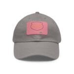 Close-up of a gray baseball cap with a pink patch on the front, showing stitching and a small top button.