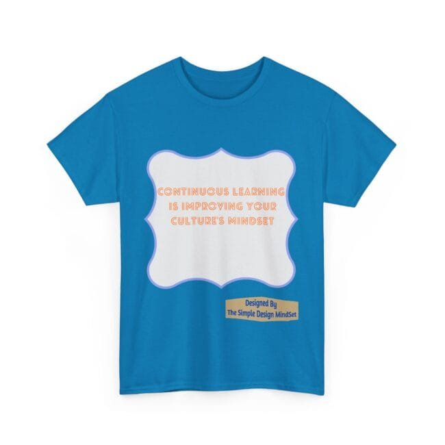 Blue T-shirt with a white decorative frame and orange text: 'Continuous learning is improving your culture's mindset', plus a designer label at the bottom right.