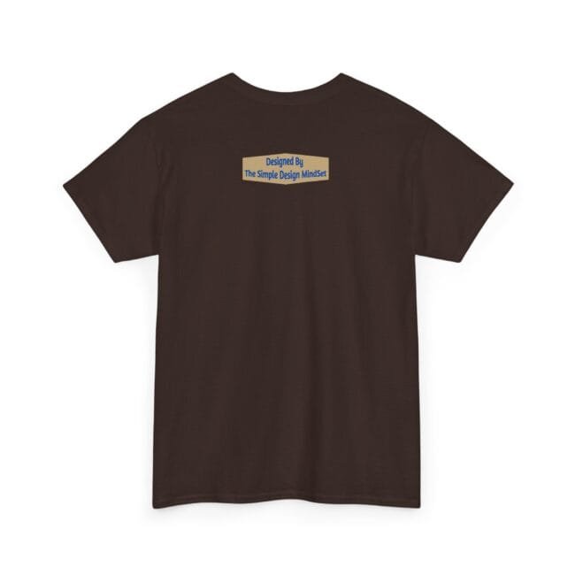 Back view of a dark brown T-shirt with a small beige label on the upper back that reads: 'Designed By The Simple Design MindSet'