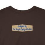 Brown t-shirt back displays a beige badge with the text: “Designed By The Simple Design MindSet.”