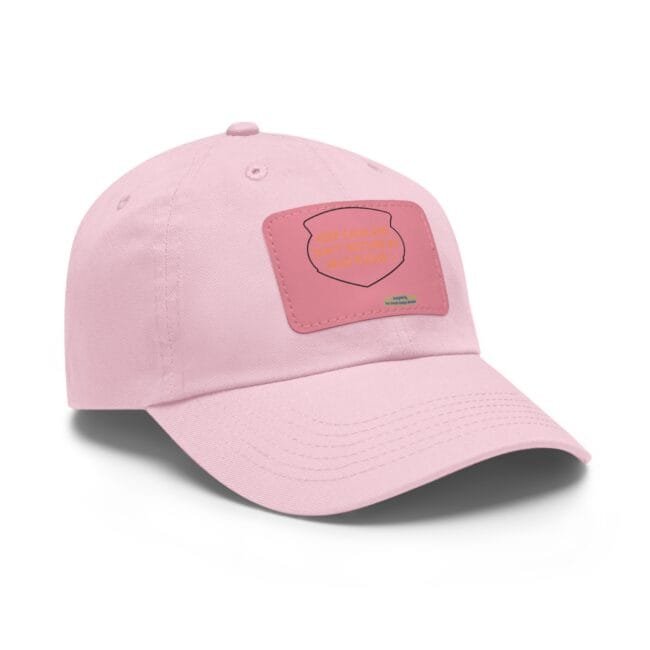 Close-up of a soft pink baseball cap with visible stitching and a front pink patch