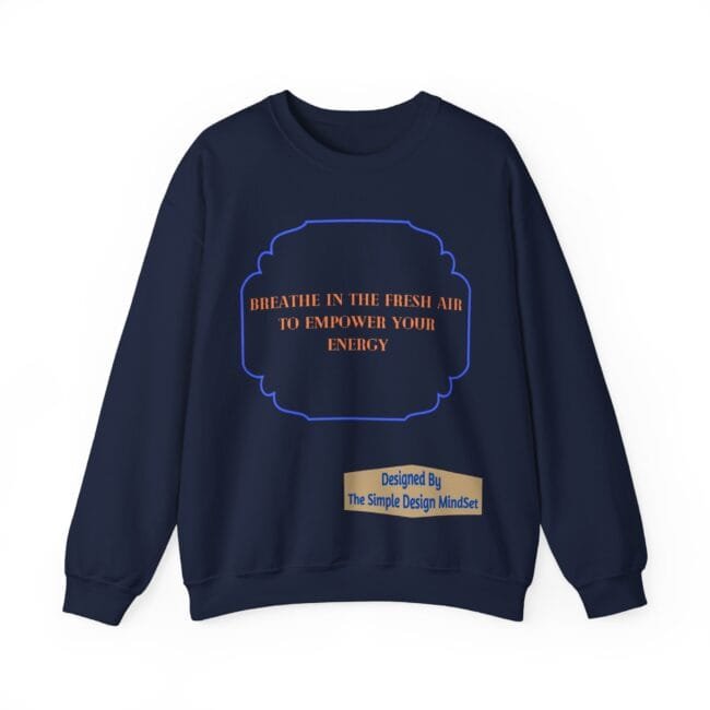 Navy sweatshirt with an orange slogan inside a blue decorative frame and a beige designer label reading 'Designed By The Simple Design MindSet'