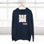 Navy hoodie on a hanger featuring a pale blue wavy frame with orange text about continuous learning, plus a small designer label.