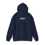 Back view of a navy hoodie with a small tan label centered on the upper back reading 'Designed By The Simple Design Mindset'.
