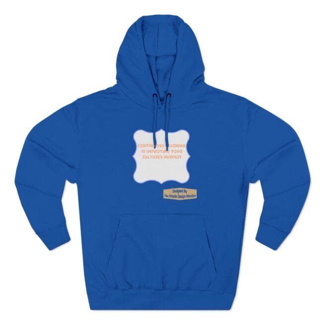Blue hoodie with drawstrings featuring a white scalloped badge on the chest; orange text reads about continual learning improving culture's mindset, plus a small beige label underneath.