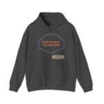 Dark gray hoodie with a purple decorative badge containing the orange slogan 'FOCUS ON WHAT YOU ARE DOING' and a small beige designer tag below.
