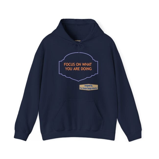 Navy hoodie with a purple decorative badge on the chest containing the orange slogan: 'FOCUS ON WHAT YOU ARE DOING'.