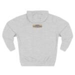 Light gray hoodie with a small rectangular badge on the chest reading 'Designed By The Simple Design MindSet'