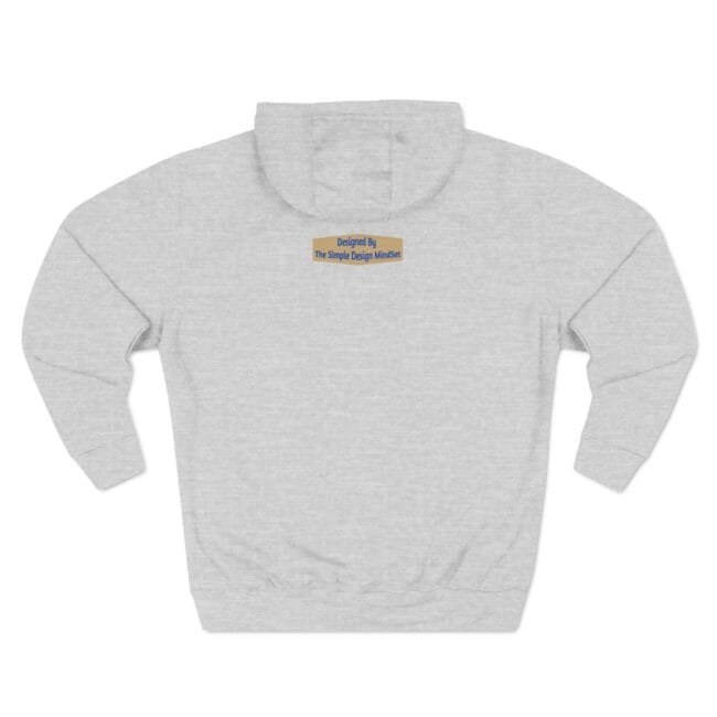 Light gray hoodie with a small rectangular badge on the chest reading 'Designed By The Simple Design MindSet'