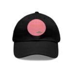 Black baseball cap with a pink circular patch on the front, featuring a shield outline design.