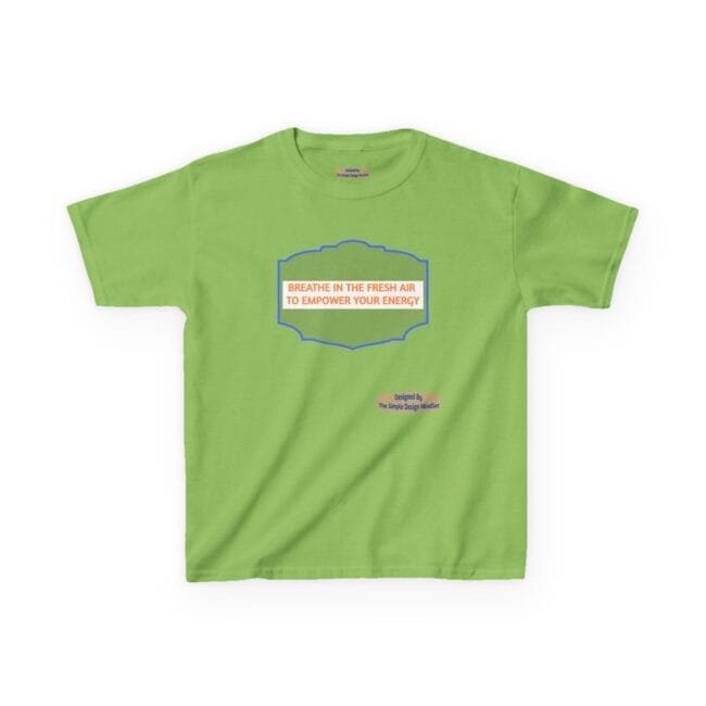Green T-shirt with blue ornate frame and orange text: 'BREATHE IN THE FRESH AIR TO EMPOWER YOUR ENERGY' and a small designer credit nearby
