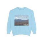 Light blue sweatshirt featuring a desert landscape graphic with the phrase 'Take a coffee or juice in the desert to resolve the problem'.