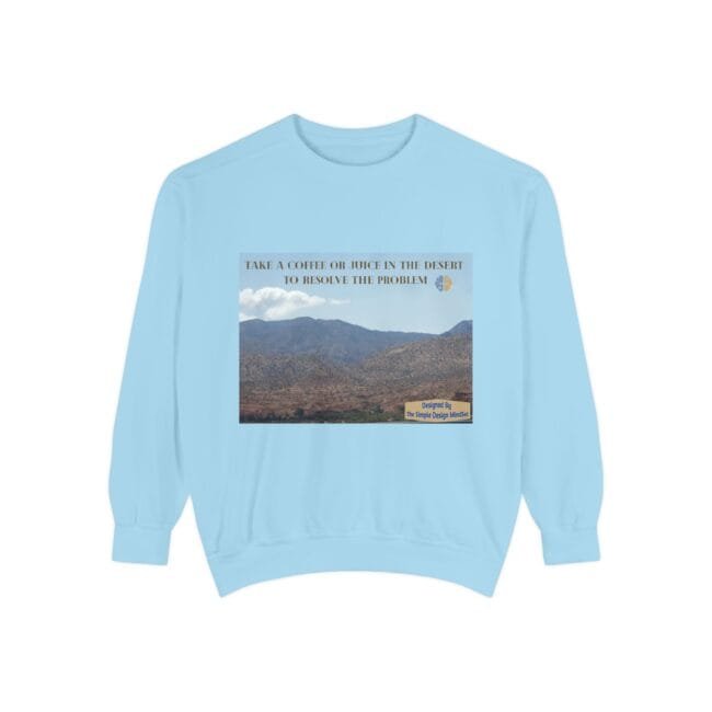 Light blue sweatshirt featuring a desert landscape graphic with the phrase 'Take a coffee or juice in the desert to resolve the problem'.