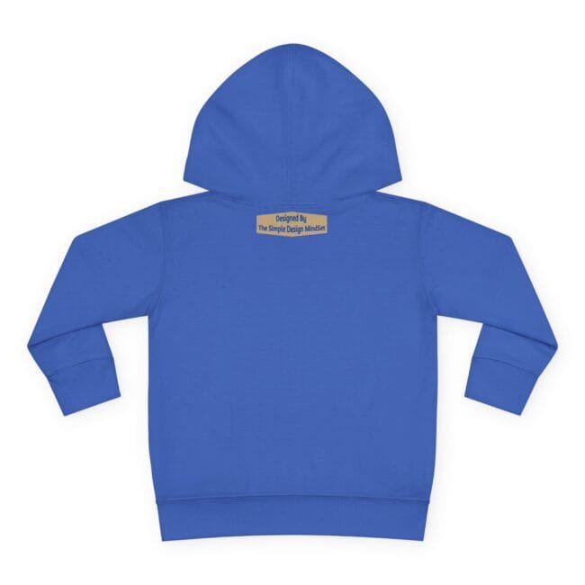 Blue hoodie viewed from the back with a small tan label near the neck reading: Designed By The Simple Design MindSet.