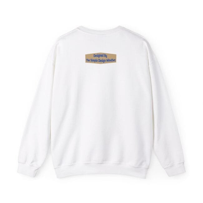 White sweatshirt viewed from the back with a small tan label near the upper center that reads 'Designed By The Simple Design MindSet'.