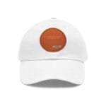 White baseball cap featuring an orange circular patch on the front with the motto: 'Focus on doing during your way of life' and a small blue designer label beneath.