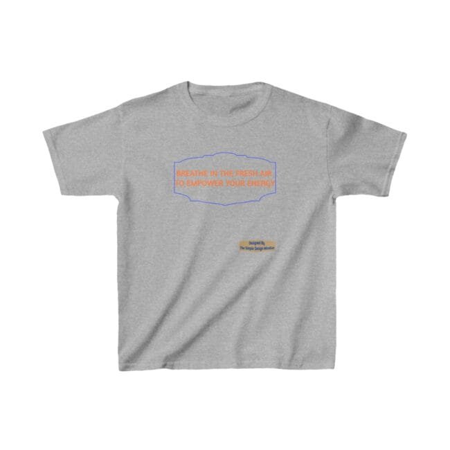 Gray t-shirt featuring an orange slogan inside a blue decorative frame: 'BREATHE IN THE FRESH AIR TO EMPOWER YOUR ENERGY'. Small designer label below says 'Designed By The Simple Design Mindset'.