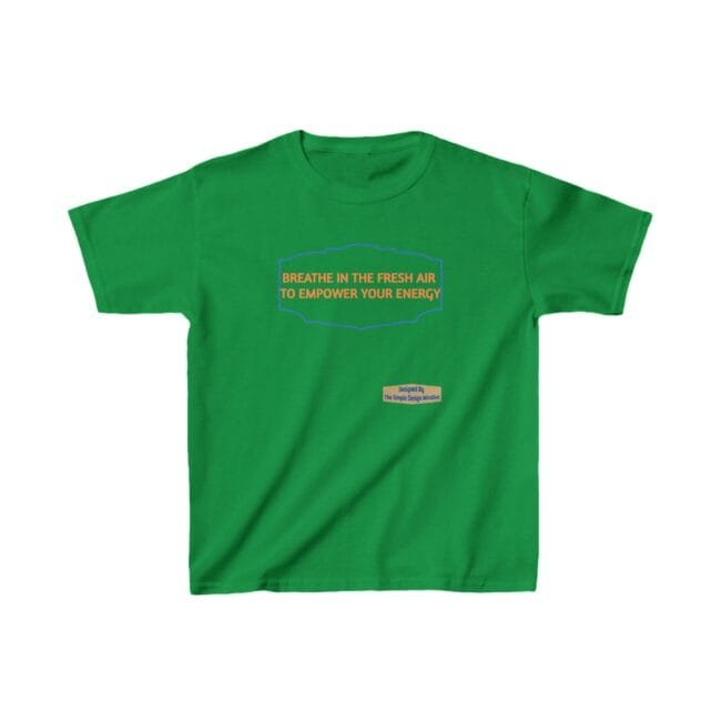Green T-shirt with orange slogan reading 'BREATHE IN THE FRESH AIR TO EMPOWER YOUR ENERGY' inside a blue decorative frame; small designer tag near the hem.
