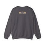 Back view of a dark gray crewneck sweatshirt with a small tan label on the upper back reading 'Designed By The Simple Design MindSet'