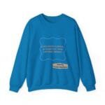 Bright blue sweatshirt with a decorative purple frame and orange text: 'Continuous learning is improving your cultures mindset' plus a small beige label reading 'Designed By The Simple Design MindSet'