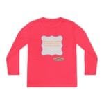 Pink long-sleeve shirt featuring a gray scalloped badge with the text about continuous learning and a small designer label nearby.