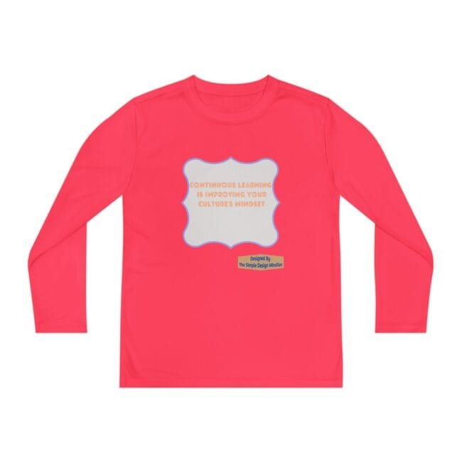 Pink long-sleeve shirt featuring a gray scalloped badge with the text about continuous learning and a small designer label nearby.