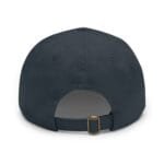 Back view of a navy baseball cap with an adjustable strap and brass buckle visible at the rear.