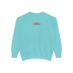 Back view of a turquoise sweatshirt with a small yellow label on the upper back reading 'Designed By The Simple Design Mindset'.)
