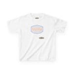 White tee featuring a centered blue-bordered badge with an orange slogan: 'BREATHE IN THE FRESH AIR TO EMPOWER YOUR ENERGY', plus a small designer label