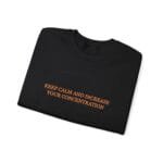 Black folded T-shirt with orange text: 'KEEP CALM AND INCREASE YOUR CONCENTRATION' over a faint brain outline.