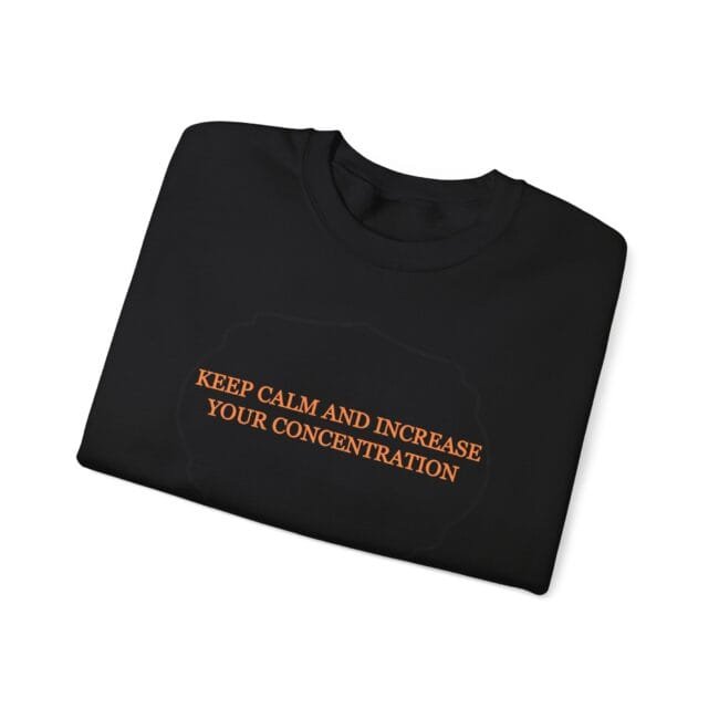 Black folded T-shirt with orange text: 'KEEP CALM AND INCREASE YOUR CONCENTRATION' over a faint brain outline.