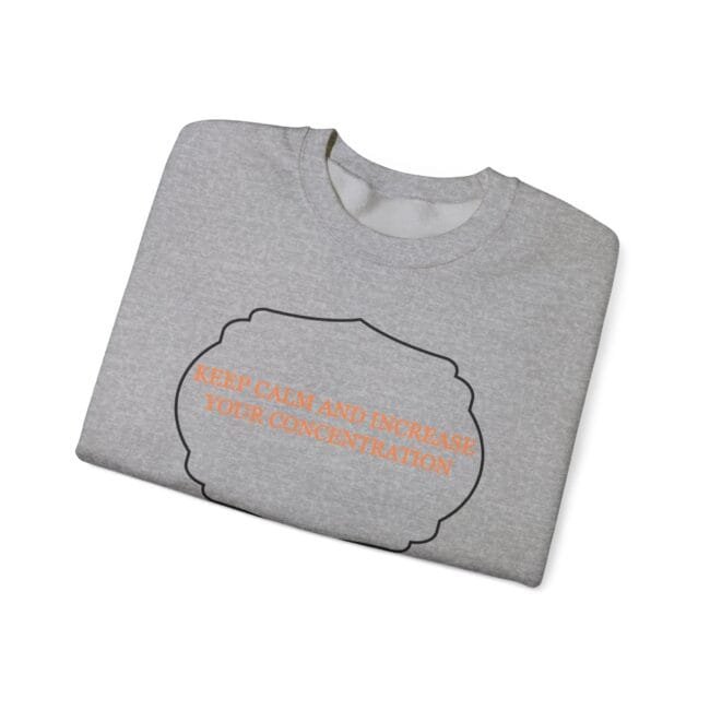 Folded light gray T-shirt with an orange slogan: "KEEP CALM AND INCREASE YOUR CONCENTRATION" inside a black-cloud outline.