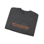 Dark gray folded t-shirt with an orange slogan: 'KEEP CALM AND INCREASE YOUR CONCENTRATION' inside a black cloud outline.