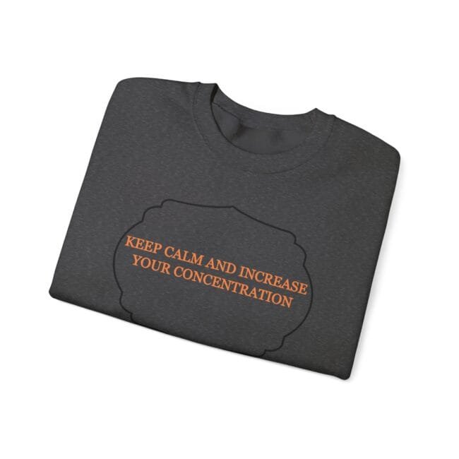 Dark gray folded t-shirt with an orange slogan: 'KEEP CALM AND INCREASE YOUR CONCENTRATION' inside a black cloud outline.