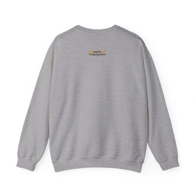 Back view of a light gray sweatshirt with a small orange tag on the upper back.