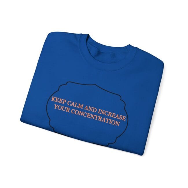 Blue folded T-shirt featuring a black cloud outline with the orange slogan: 'KEEP CALM AND INCREASE YOUR CONCENTRATION'.