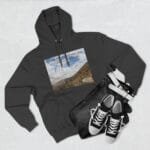 Dark gray hoodie showing a front print of a hillside landscape with blue sky and clouds and the phrase 'Keep calm and increase your concentration'