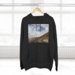 Black hoodie featuring a landscape print on the chest with the phrase 'Keep calm and increase your concentration' and a small designer label.