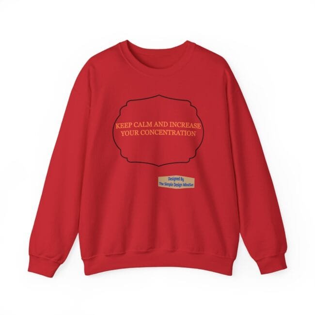 Red sweatshirt featuring a decorative black frame with the phrase 'KEEP CALM AND INCREASE YOUR CONCENTRATION' in orange text, plus a small designer label at the bottom center