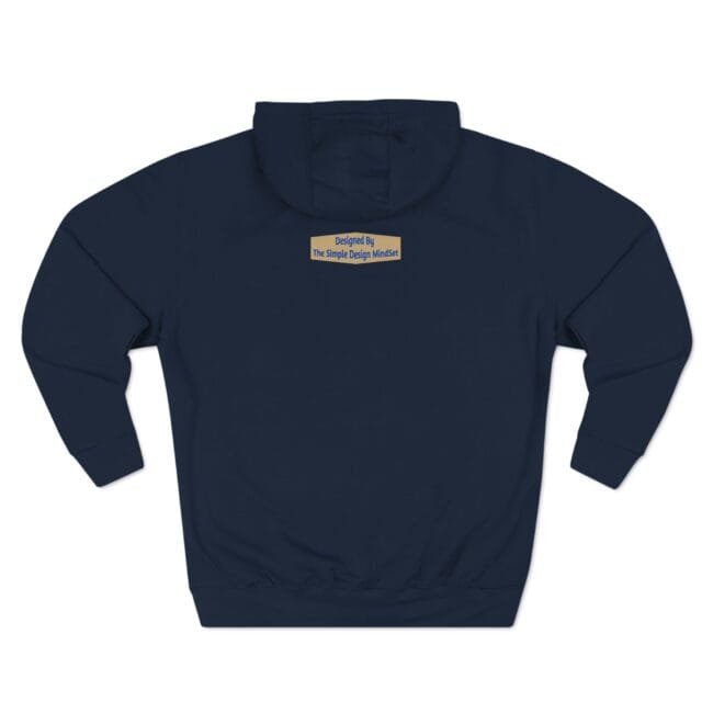 Back view of a navy hoodie featuring a small beige label centered on the upper back that reads 'Designed By The Simple Design MindSet'