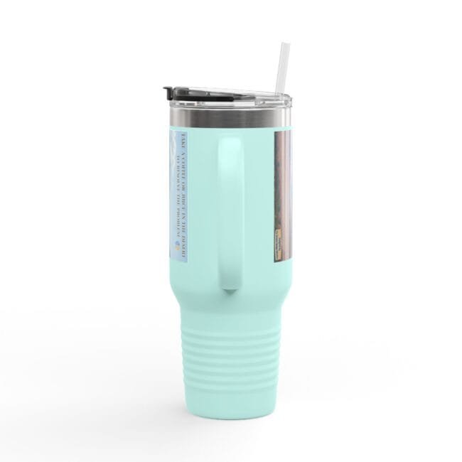 Mint green insulated tumbler with a clear lid and straw, showing side labels/graphics for a product photo.