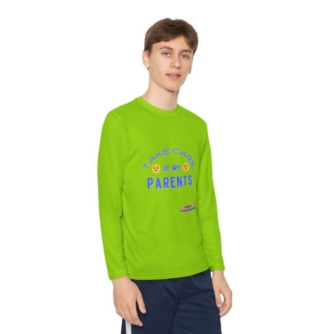 Bright lime-green long-sleeve shirt worn by a person, with text 'TAKE CARE OF MY PARENTS' and small design near the hem
