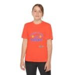 Teenage girl wearing a bright orange T-shirt with a blue slogan that says 'Take care of my parents'.