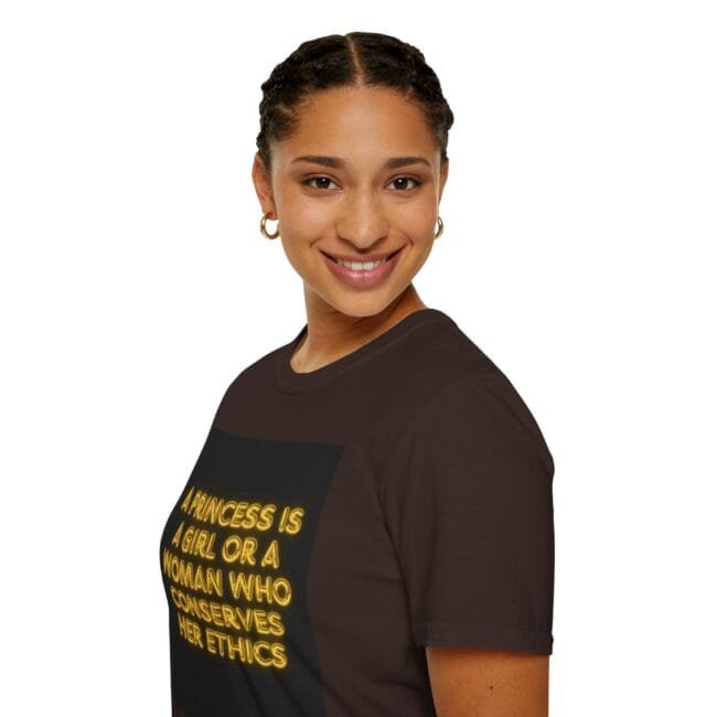 Smiling woman with braided hair wearing a dark brown T-shirt that reads: 'A princess is a girl or a woman who conserves her ethics.'