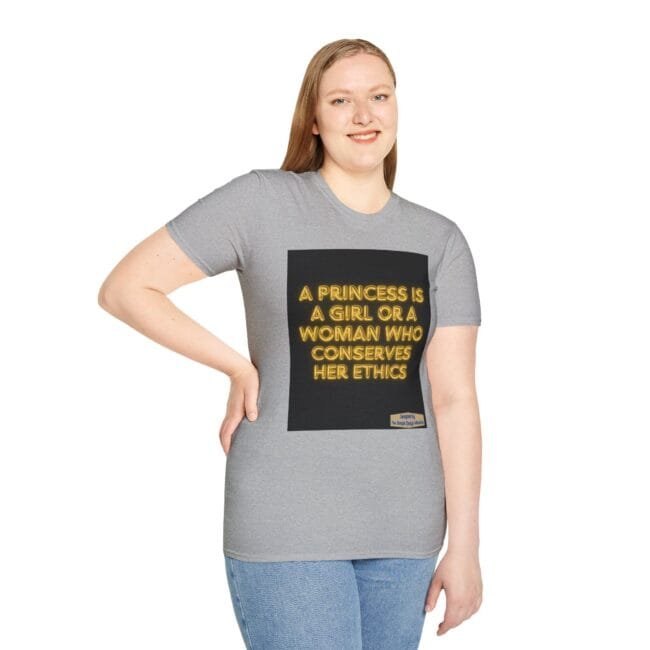 Woman wearing a gray t-shirt with a black square graphic displaying the neon yellow text: 'A PRINCESS IS A GIRL OR A WOMAN WHO CONSERVES HER ETHICS'.