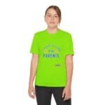 Young person wearing a bright lime green T-shirt with the blue text 'Take care of my parents' and accompanying emoji icons.