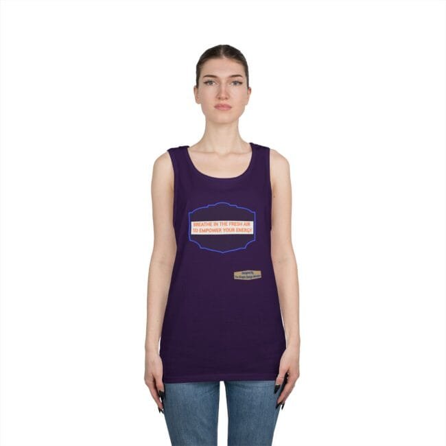 Model wearing a purple tank top featuring an orange slogan: "BREATHE IN THE FRESH AIR TO EMPOWER YOUR ENERGY" with a small label badge at the hem.