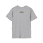 Light gray T-shirt viewed from the back with a small yellow label on the upper back reading 'Designed By The Simple Design Mindset'.