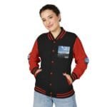 Young woman wearing a black and red varsity jacket with striped cuffs, smiling and hands in pockets.